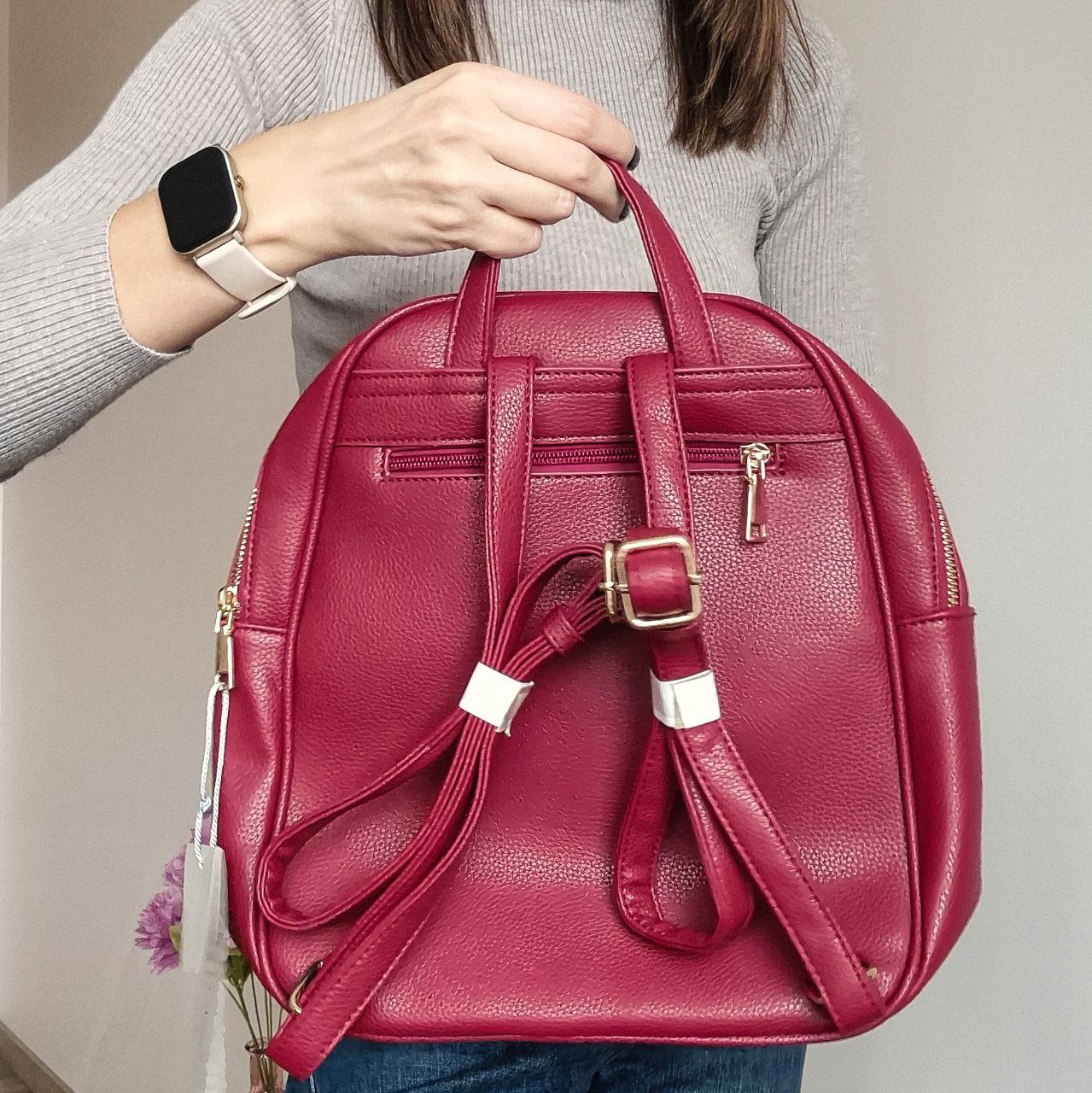 Women's red quilted backpack