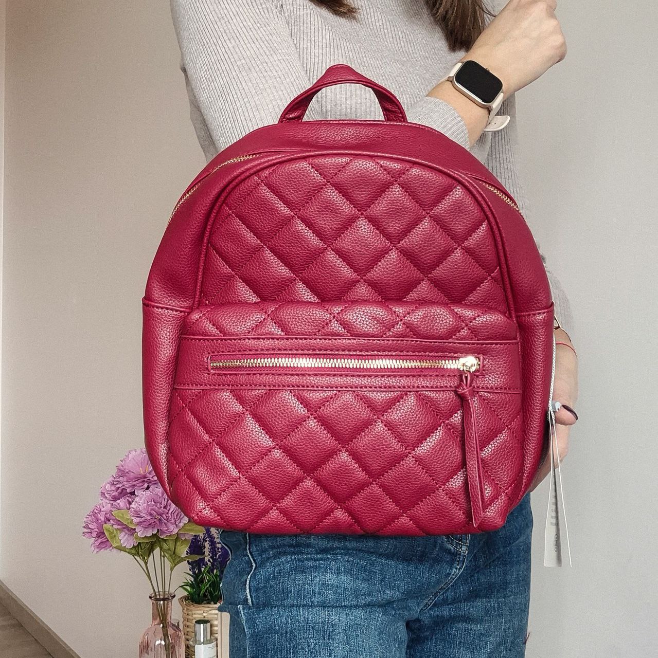 Women's red quilted backpack